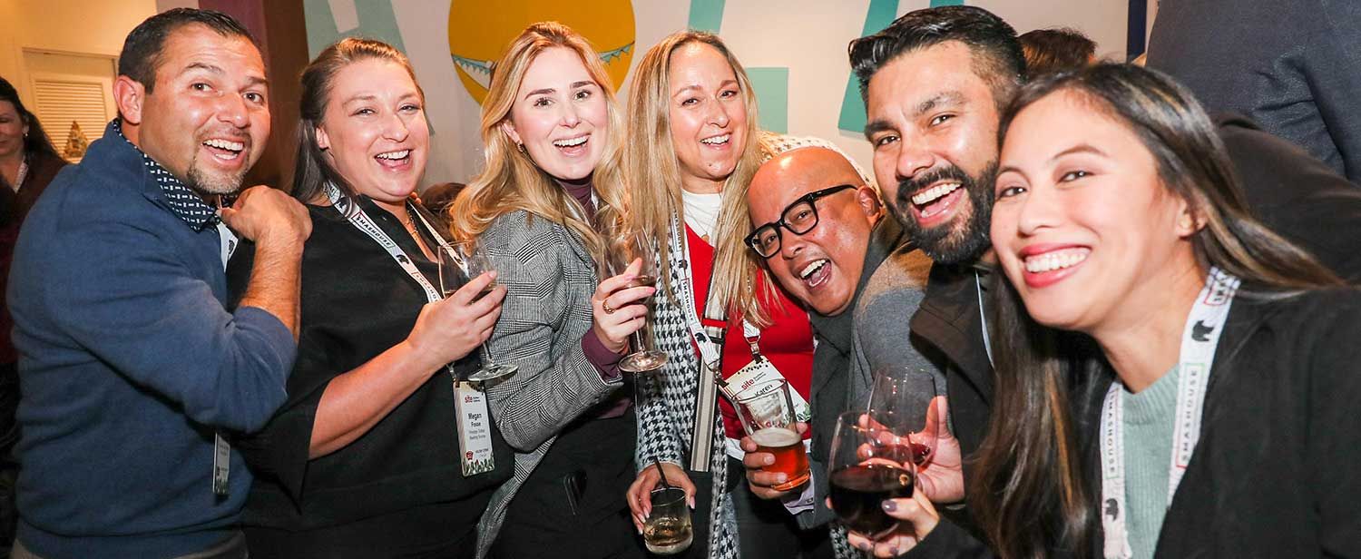 a group of happy SITE SoCal members with drinks at the Holiday Event & Charity Gala.